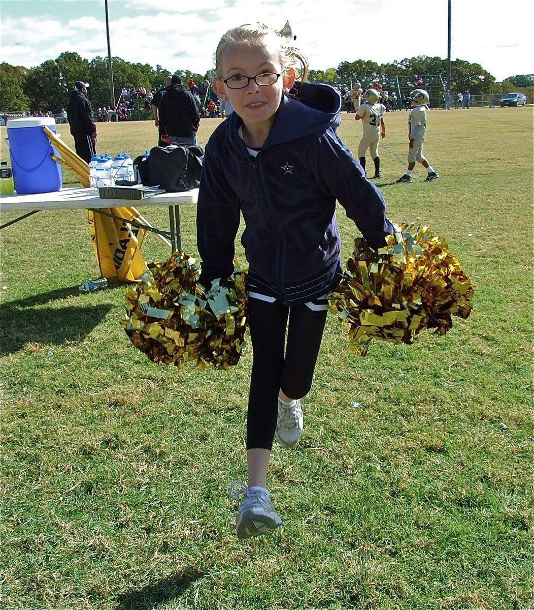 Image: Rise, Italy! — IYAA cheerleader Madelyn Chambers helps cheer on the B-Team Gladiators to a win over Palmer.
