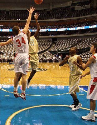 Image: Mayberry scores — Italy’s De’Andre Sephus(20) clears a landing while Larry Mayberry, Jr.(13) executes a helicopter spin to score 2-points over Mineral Wells’ Skylar Flaska(34)