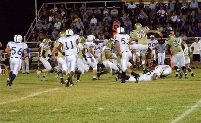 Image: Gladiators converge — Gladiators Heath Clemons(2), Kyle WIlkins(7), De’Andre Rettig(60), Kyle Jackson(28), Brandon Souder(63), Bobby Wilson(64), Jamal Jalarnce Lewis(30) hustle to the ball.