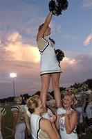 Image: Sky’s the limit — IHS Cheerleaders Cassi Jeffords, Destani Anderson and Mary Tate hoist Morgan Cockerham into the evening air before the Homecoming game kickoff.