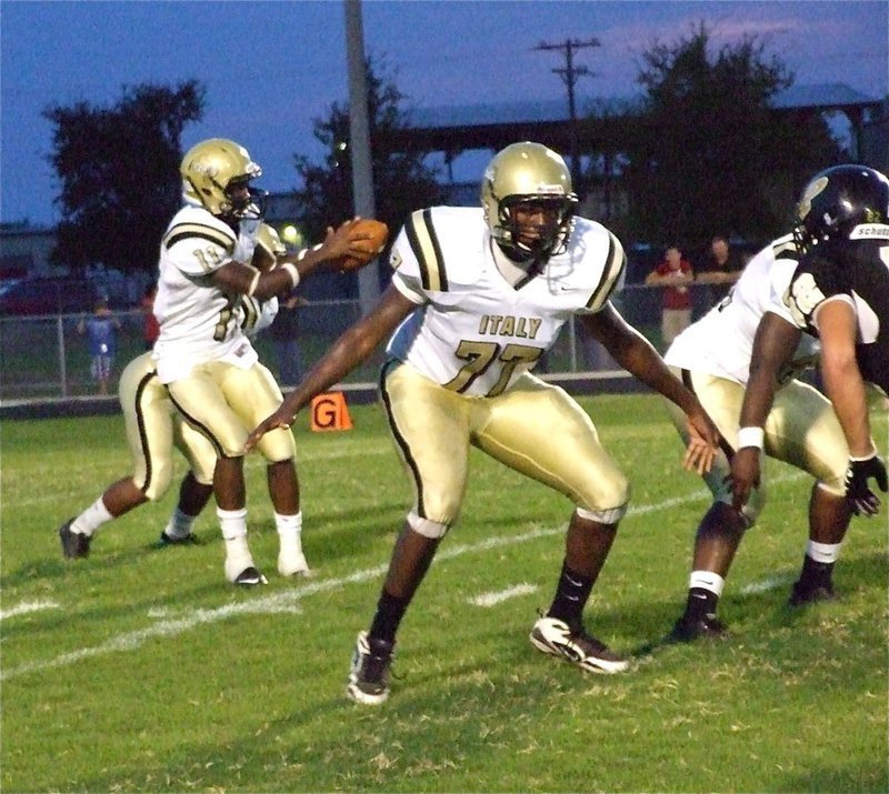 Image: Larry protects Jasenio — Right offensive tackle Larry Mayberry(77) attempts to keep his quarterback safe.