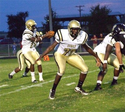 Image: Larry protects Jasenio — Right offensive tackle Larry Mayberry(77) attempts to keep his quarterback safe.
