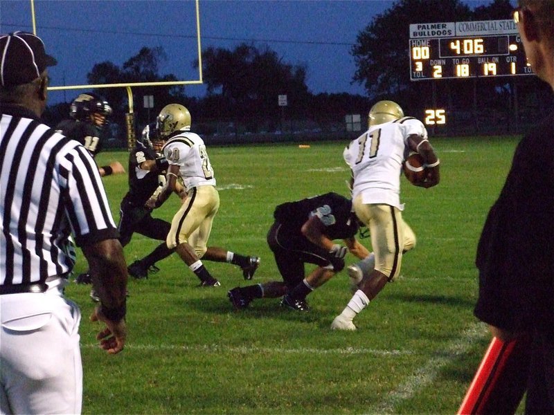 Image: Down the sideline — Gladiator quarterback Jasenio Anderson(11) picks up extra yards thanks to the downfield blocking heroics of De’Andre Sephus(20).