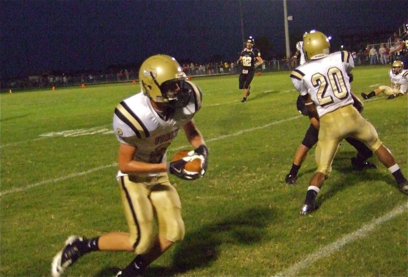 Image: Jase gets yardage — Jase Holden(6) hauls in a pass, picks up a downfield block from De’Andre Sephus(20) and picks up 9-yards on first down.