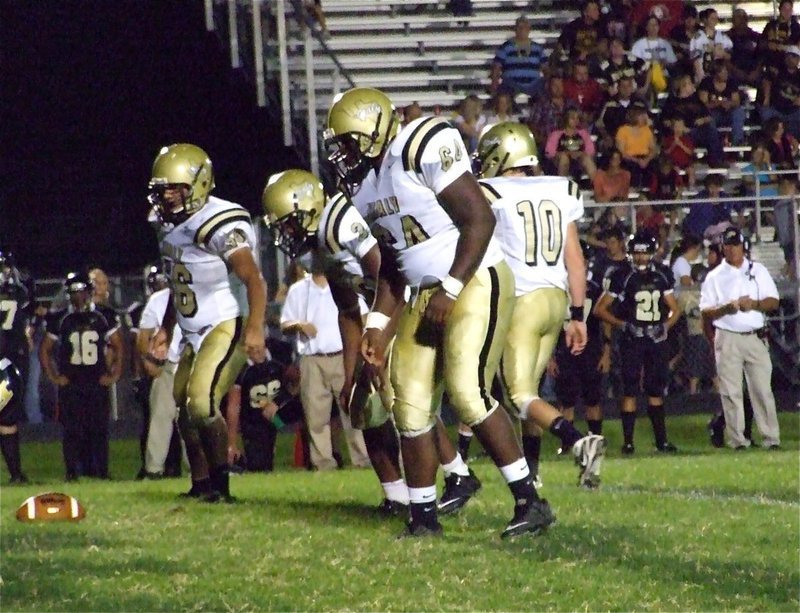 Image: Gladiator shields — The Italy defensive line anchored by Bobby Wilson(64), nose tackle Jalarnce Jamal Lewis(30) and right tackle Omar Estrada(56) get the job done against the Bulldogs.