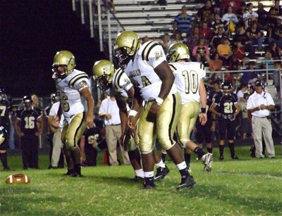 Image: Gladiator shields — The Italy defensive line anchored by Bobby Wilson(64), nose tackle Jalarnce Jamal Lewis(30) and right tackle Omar Estrada(56) get the job done against the Bulldogs.