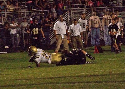 Image: In the Red Zone — Italy’s De’Andre Sephus(20) catches a 26-yard pass before being tackled by a Bulldog defender in the second half.