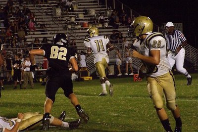 Image: Looking to pass? — Italy’s Omar Estrada(56) throws a block and Kyle Jackson(28) heads downfield while quarterback Jasenio Anderson rolls out to pass…or is he?
