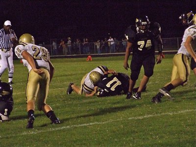 Image: Simon sacks — Gladiator linebacker Ethan Simon sacks Palmer’s quarterback.