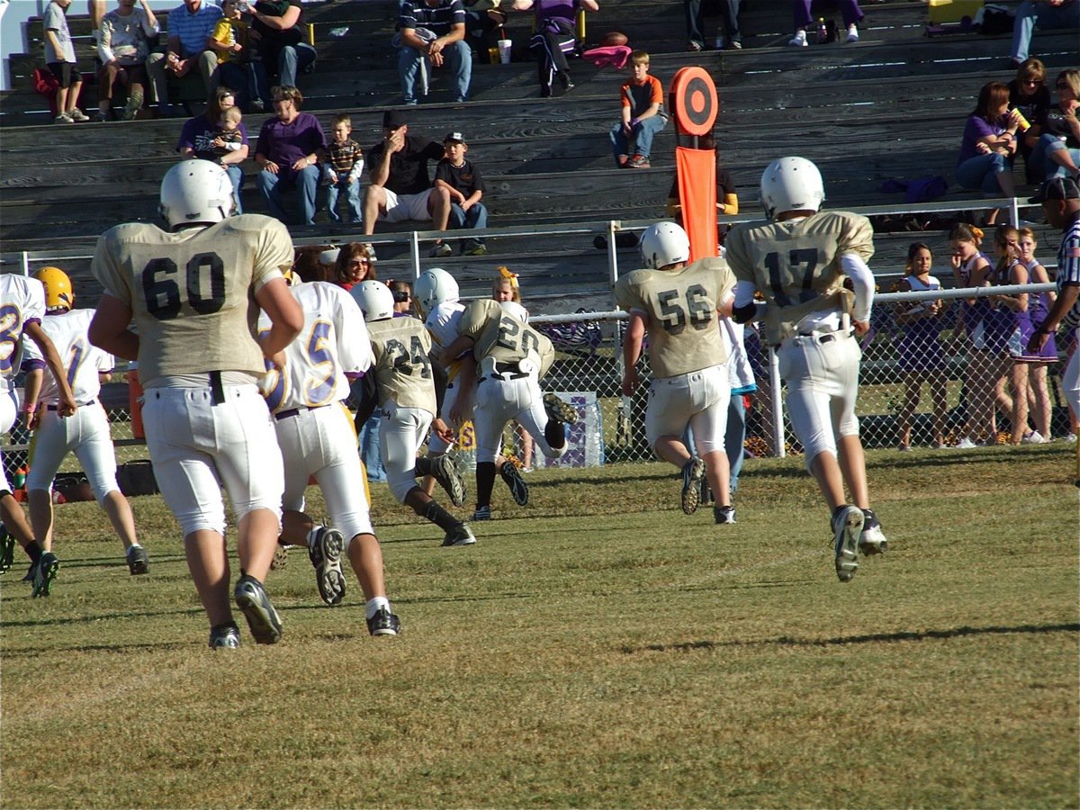 Image: Good tackle — Italy’s Lance Peck(20) catches a Bison runner from behind.