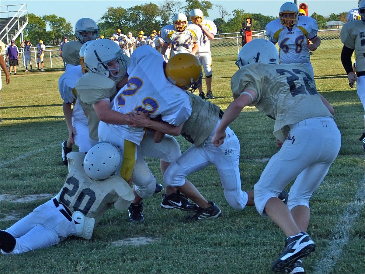 Image: Group tackle — Several Gladiators bring down a Bison runner.