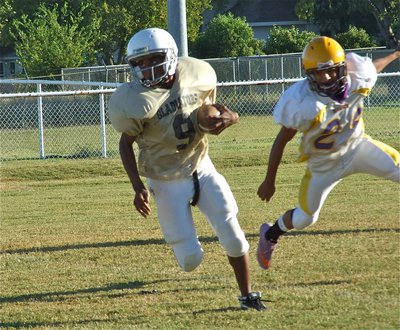 Image: JaRay gets away — JaRay Anderson(9) escapes the Buffalo herd.