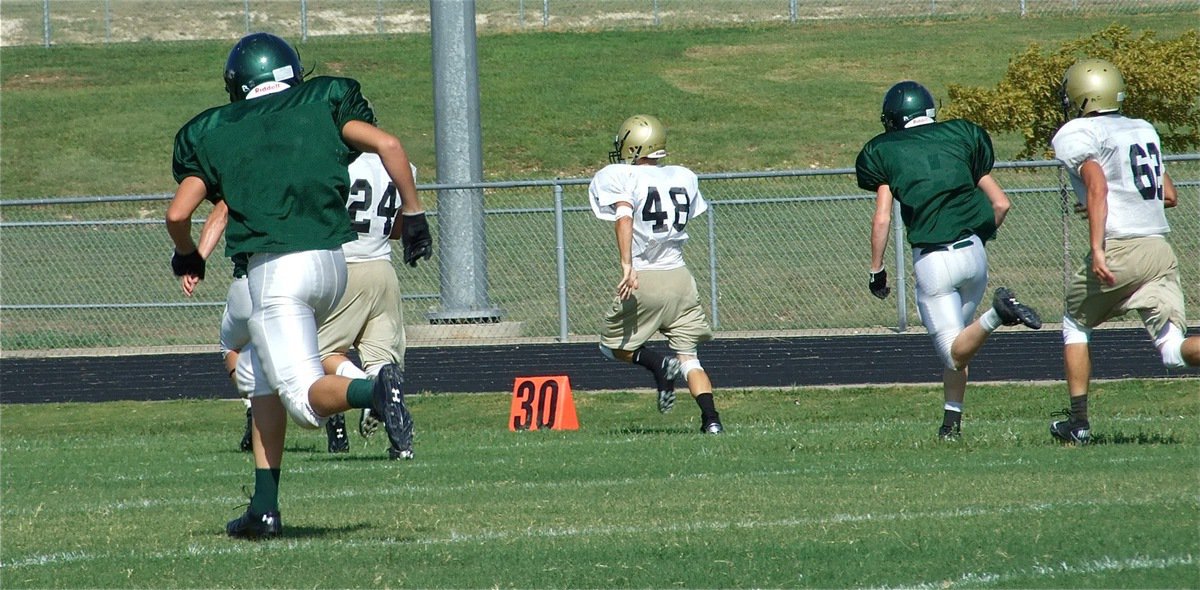 Image: On the run — Italy’s Chase Hamilton(48), a sophomore, breaks away from the flock for a 49-yard gain.