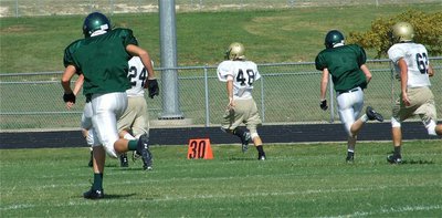 Image: On the run — Italy’s Chase Hamilton(48), a sophomore, breaks away from the flock for a 49-yard gain.