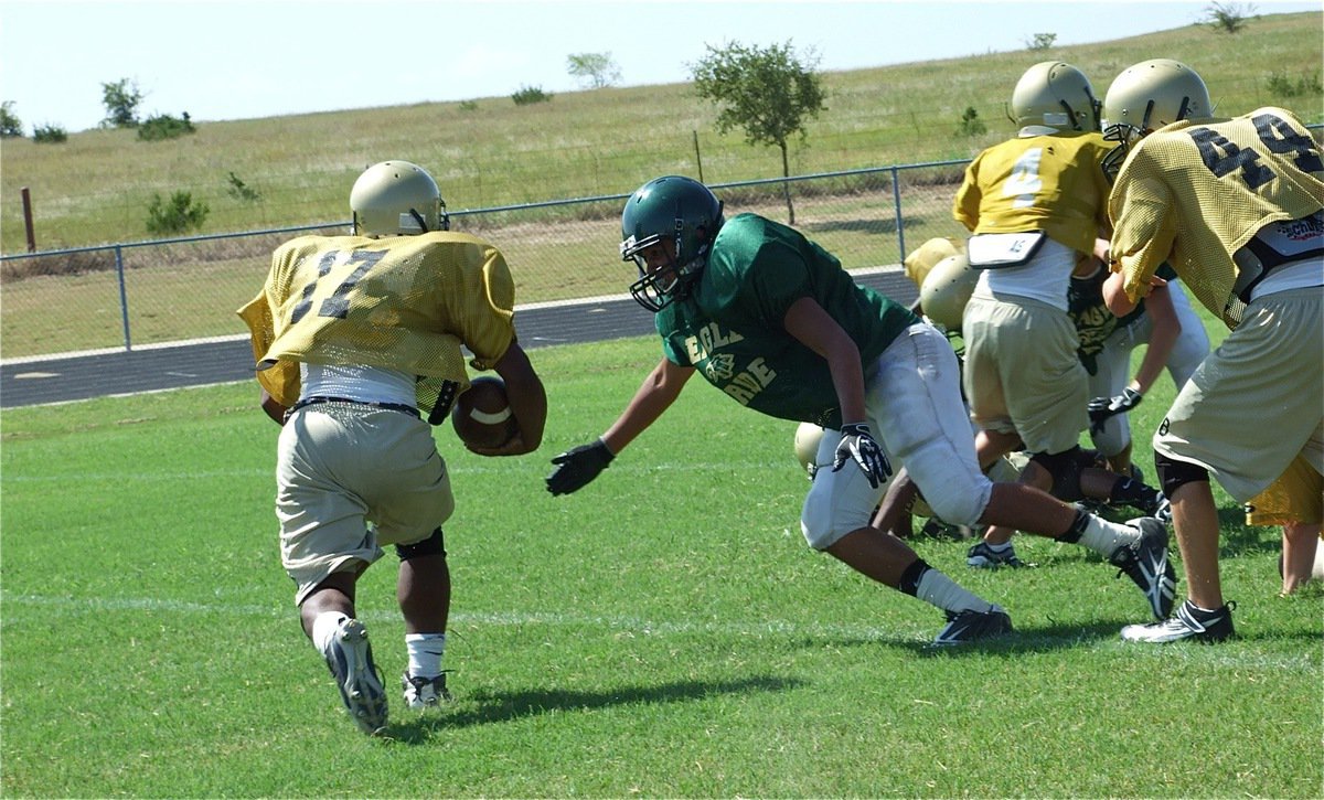 Image: Who is that? — The latest addition to the Gladiator roster is Jalarnce Jamal Lewis(17) who opened the JV game up with a 70-yard touchdown run. Above, Lewis avoids a tackle and trots in for Italy’s second score.