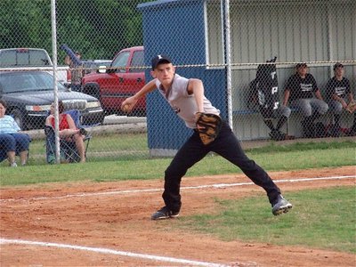 Image: Wood plays the bunt — Pitcher Justin Wood covers a bunt against Whitney Black.