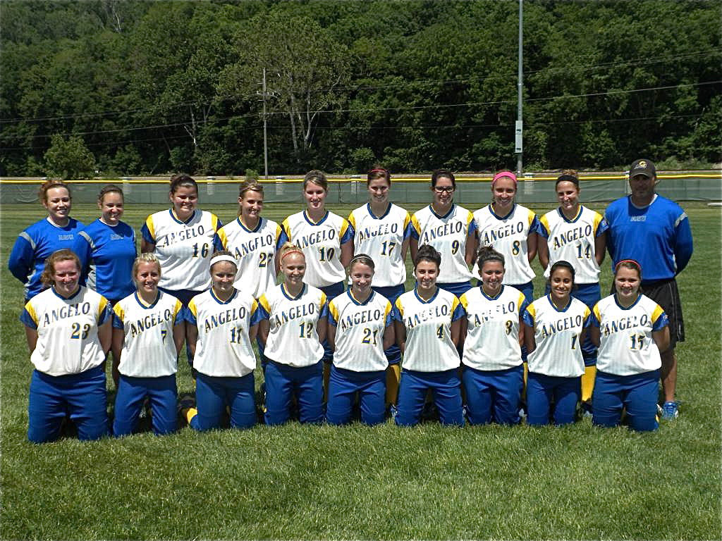 Image: The Lady Rambelles — Sarah DeMoss #12 poses with her Angelo State Lady Rambelles Softball Team.