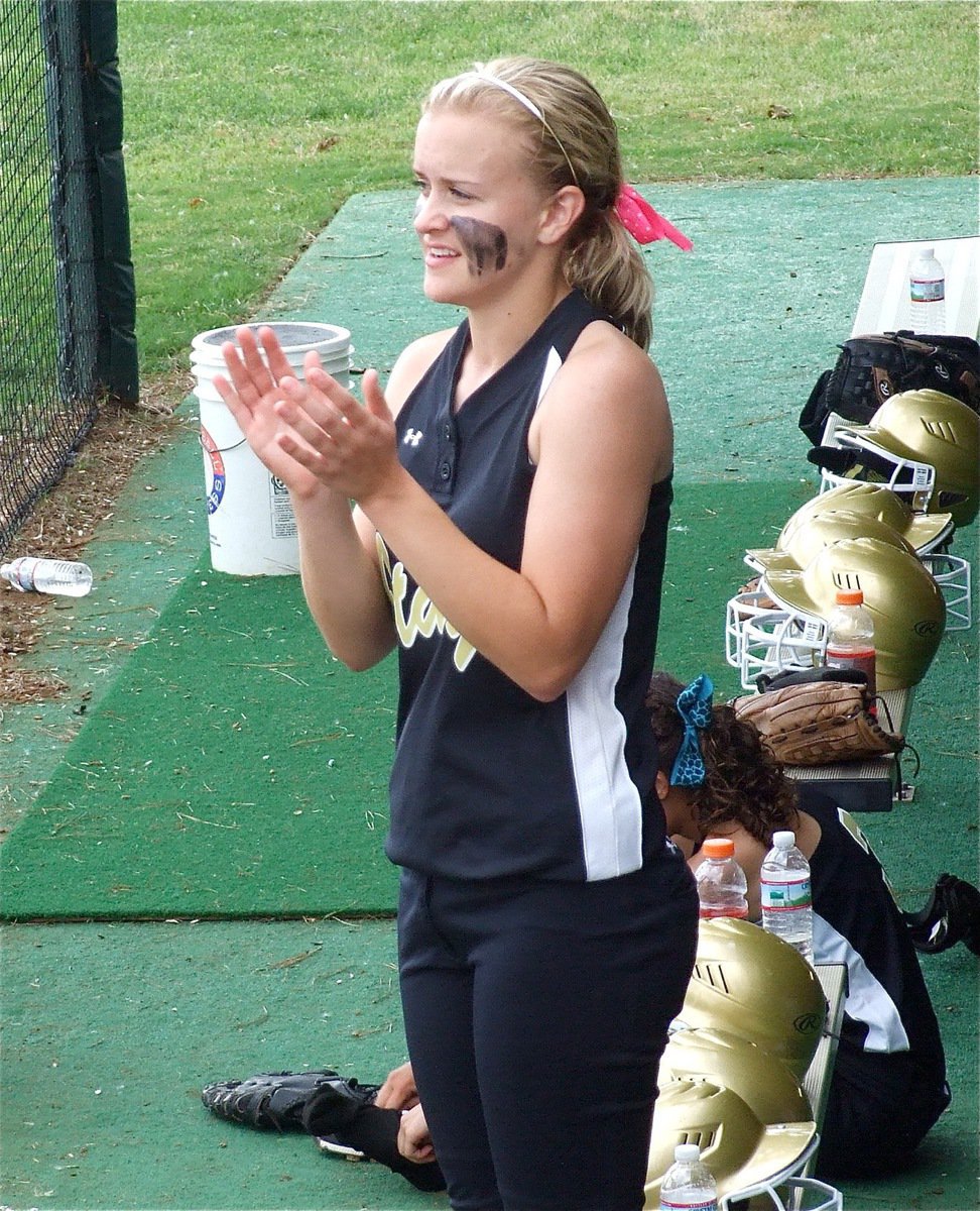Image: Senior leadership — Pitcher Courtney Westbrook encourages her teammates from the dugout.
