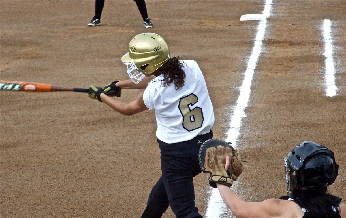 Image: Anna takes a swing — Anna Viers(6) tries to get the softball rolling for the Lady Gladiators against Meridian.