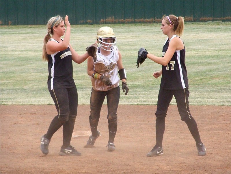 Image: Drew gets swarmed — After being thrown out at second base, Drew Windham disrupts the Lady ’Jacket celebration.