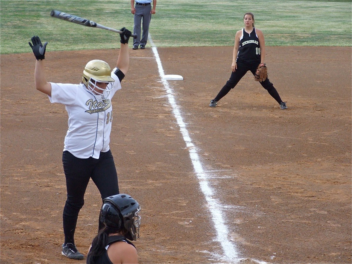 Image: Jeffords steps it up — Cori Jeffords(15) steps up to the plate and rockets a 220 foot homerun over the Meridian defense and over the centerfield fence in Joshua. History repeats itself as Jeffords duplicated her over the fence homerun effort from a year ago against Meridian during this same regional quarterfinal matchup.
