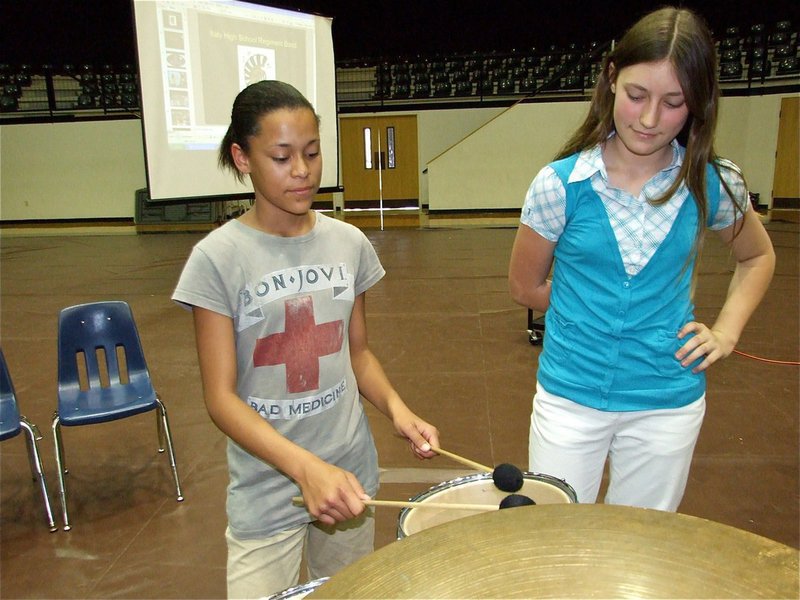 Image: Alex & Whitney — 7th grade Percussionists’ Alex Minton-Fielder and Whitney Wolaver test the drums before the Spring Concert.