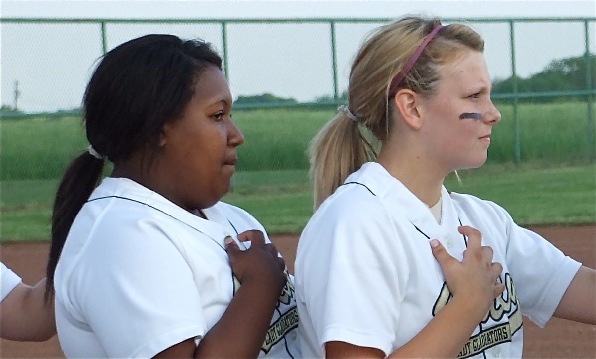Image: Home of the brave — Khadijah Davis and Casi Jefffords stand at the ready during the playing of the National Anthem before the war with Hubbard on Italy’s home field.