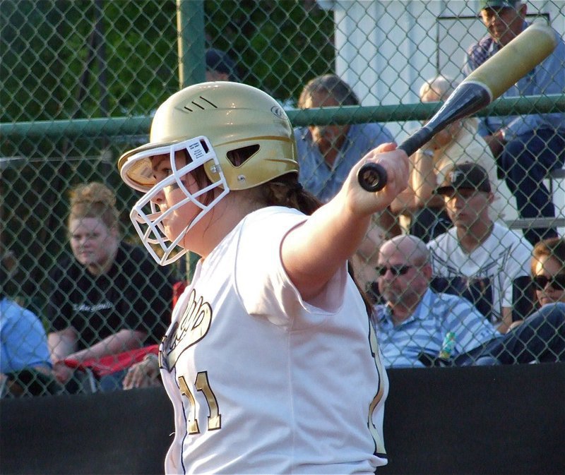 Image: The stare down — Meredith Brummett takes a practice swing before stepping into the batter’s box against Hubbard’s pitcher Cassie Skilling.