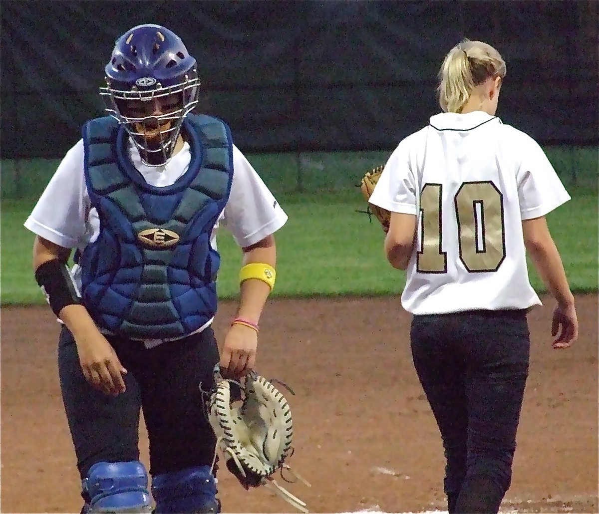 Image: Softball talk — Lady Gladiator catcher Alyssa Richards visits with pitcher Courtney Westbrook on the mound.