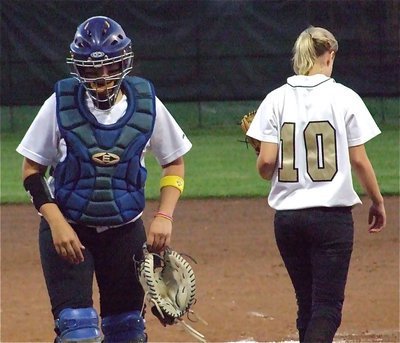 Image: Softball talk — Lady Gladiator catcher Alyssa Richards visits with pitcher Courtney Westbrook on the mound.
