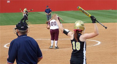 Image: Teamwork — Stay! Bailey Bumpus yells to teammate Anna Viers to stay on the bag after Viers stole second base.