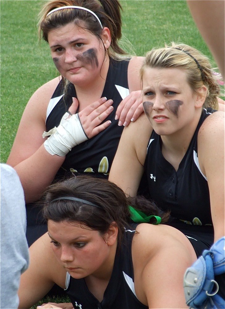 Image: Just breathe — Meredith Brummett, Cori Jeffords and Casi Jeffords try to get a handle on the moment after defeating DeLeon with a dramatic 1-0 win to become bi-district champions.
