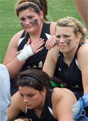 Image: Just breathe — Meredith Brummett, Cori Jeffords and Casi Jeffords try to get a handle on the moment after defeating DeLeon with a dramatic 1-0 win to become bi-district champions.