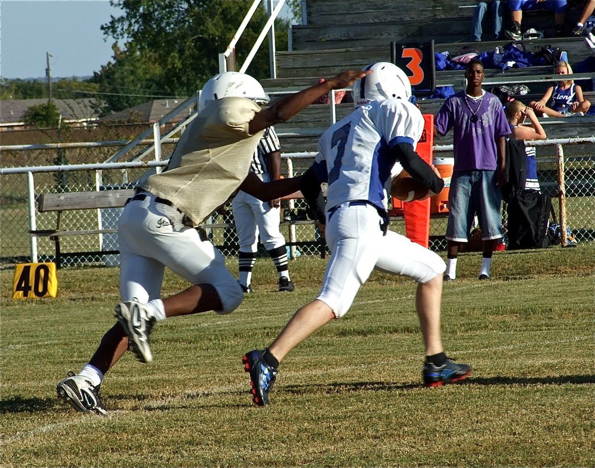 Image: Can’t escape JaRay — A thorn in the side of the Lions all game, Italy’s Jaray Anderson(9) sacks the Blooming Grove quarterback.