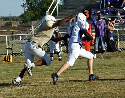 Image: Can’t escape JaRay — A thorn in the side of the Lions all game, Italy’s Jaray Anderson(9) sacks the Blooming Grove quarterback.