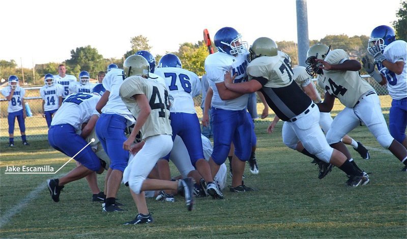 Image: ‘Football Finder’ — Sometimes it’s hard to know who’s making the tackle but Jake Escamilla makes this one.