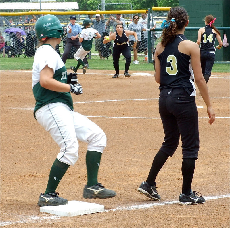 Image: Cori stalks — Senior second baseman Cori Jeffords covered first for the out and then stalks a Lady Tiger that’s rounding third base.