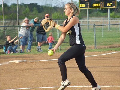 Image: Unleashed — Courtney Westbrook unleashes the heat at a Lady Bulldog batter.