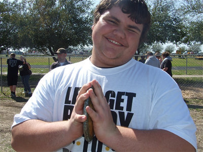 Image: Hank prays — 8th grader Hank Seabolt says a quick prayer to the track Gods before making his discus throw.