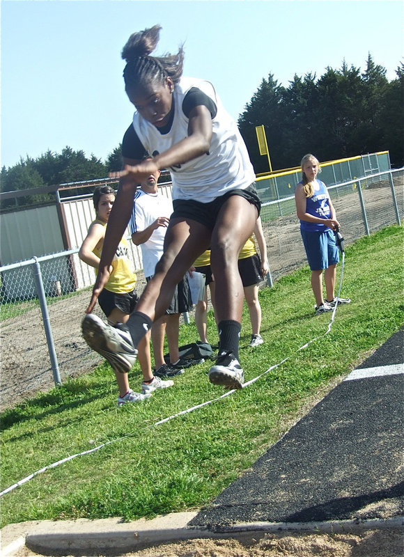 Image: Kortnei gets 1st Place — 7th grader Kortnei Johnson soars to a 1st place finish in the triple jump. It wasn’t even close!