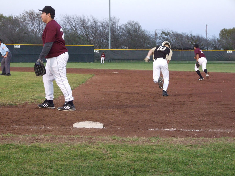 Image: Go Chase — After several attempts to steal, Chase Hamilton forges through.