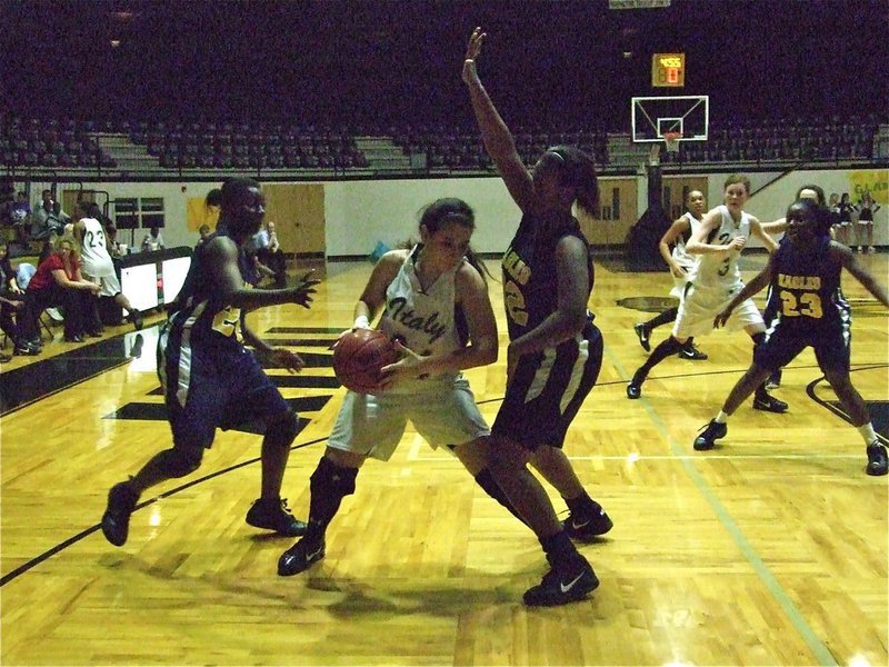 Image: Beating the trap — Alyssa Richards(24) beats the trap by the Lady Eagles.