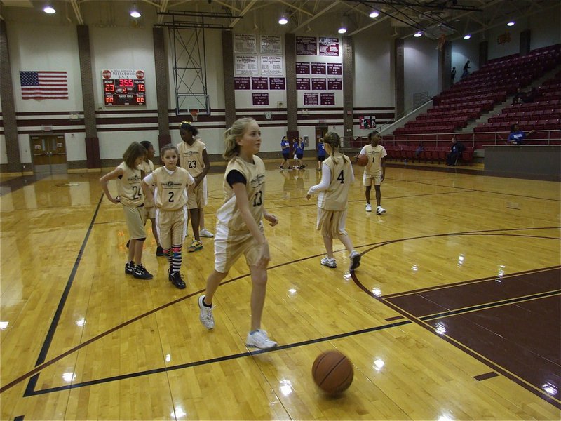 Image: Hannah’s turn — Hannah Washington(13) practices her layup before the game.