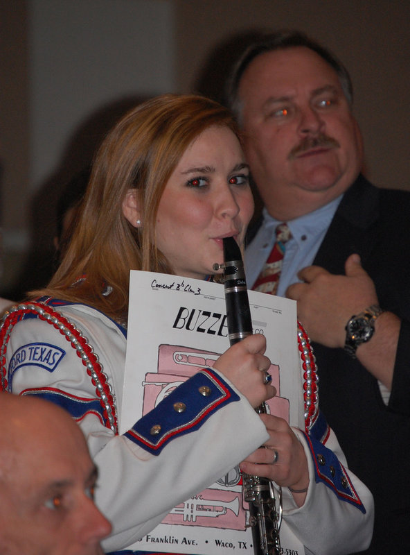 Image: Tapley Strange — Tapley Strange prepares her clarinet for the upcoming performance.