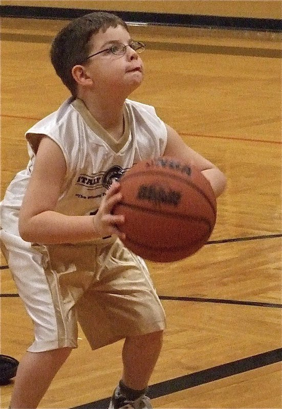 Image: Gage, gages his shot — Gage Wafer(14) uses all his might to shoot a free throw.