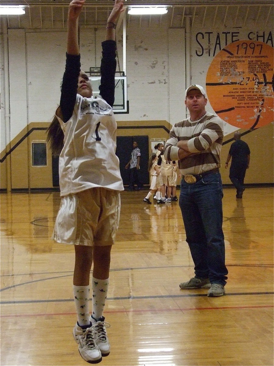 Image: Elisha shoots — Italy 14 coach, Jerry Glenn, studies Elisha McClendon’s(1) jump shot before the game.