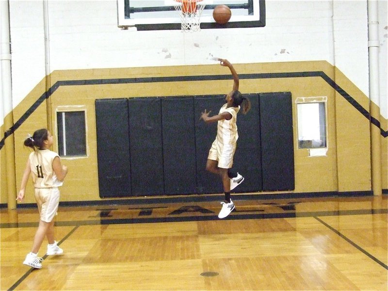 Image: DeCorea Green — Italy 24’s DeCorea Green drives in for a layup before the game as Ashlyn Jacinto(11) rebounds.