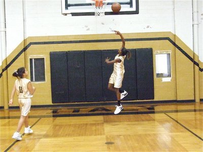 Image: DeCorea Green — Italy 24’s DeCorea Green drives in for a layup before the game as Ashlyn Jacinto(11) rebounds.