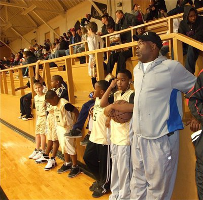 Image: Norwood’s Netpoppers — Coach Ken Norwood stands with members of his team before their game.