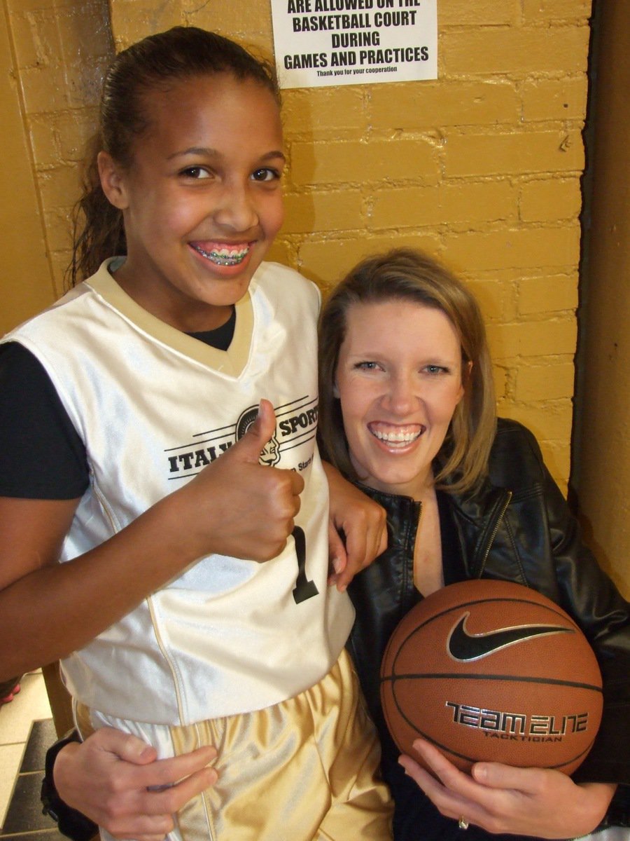 Image: Emily &amp; Michelle — Emily Cunningham celebrates a strong performance with her mom, Michelle Cunningham, after the game.